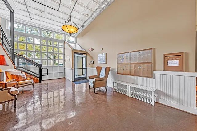 a view of livingroom with furniture and book shelf