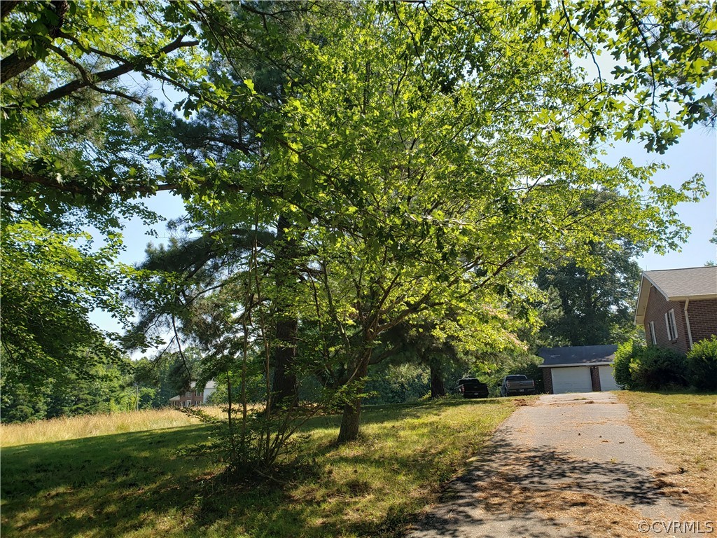 3684 Cedar Plains Road Sandy Hook, VA 23153 - Photo 16 of 21 View of yard with a garage and an outdoor structur