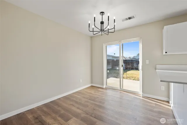 a spacious bedroom with a large bed and a window