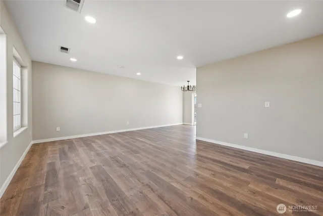a view of a kitchen with a sink and a window