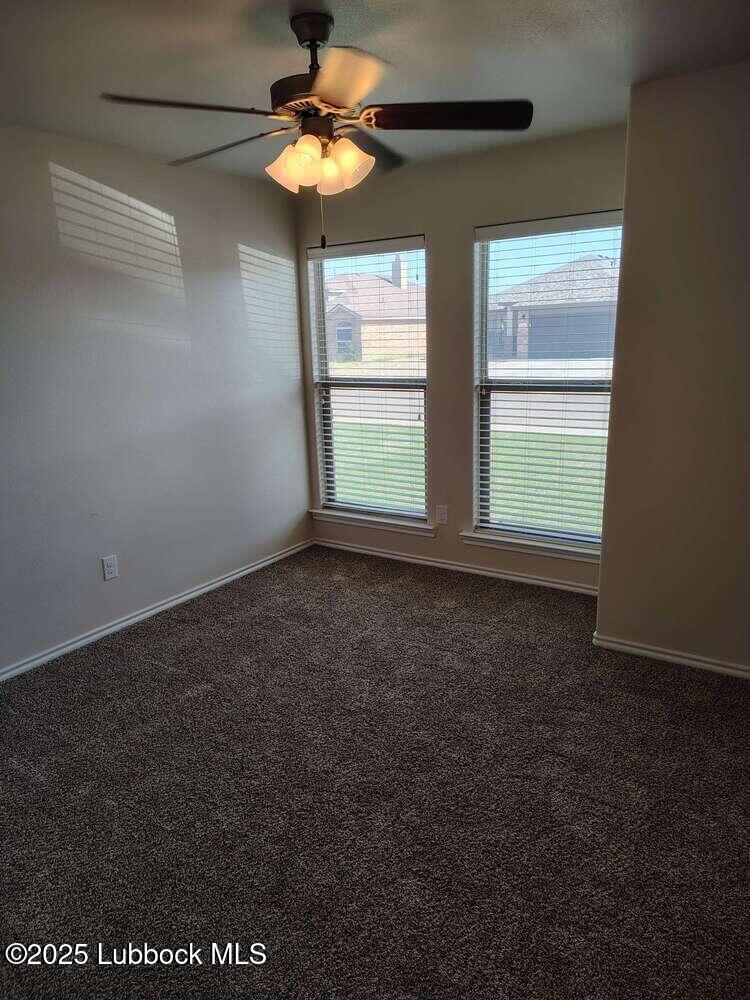 7046 95th Street Lubbock, TX 79424 - Photo 11 of 23 a view of an empty room with a window