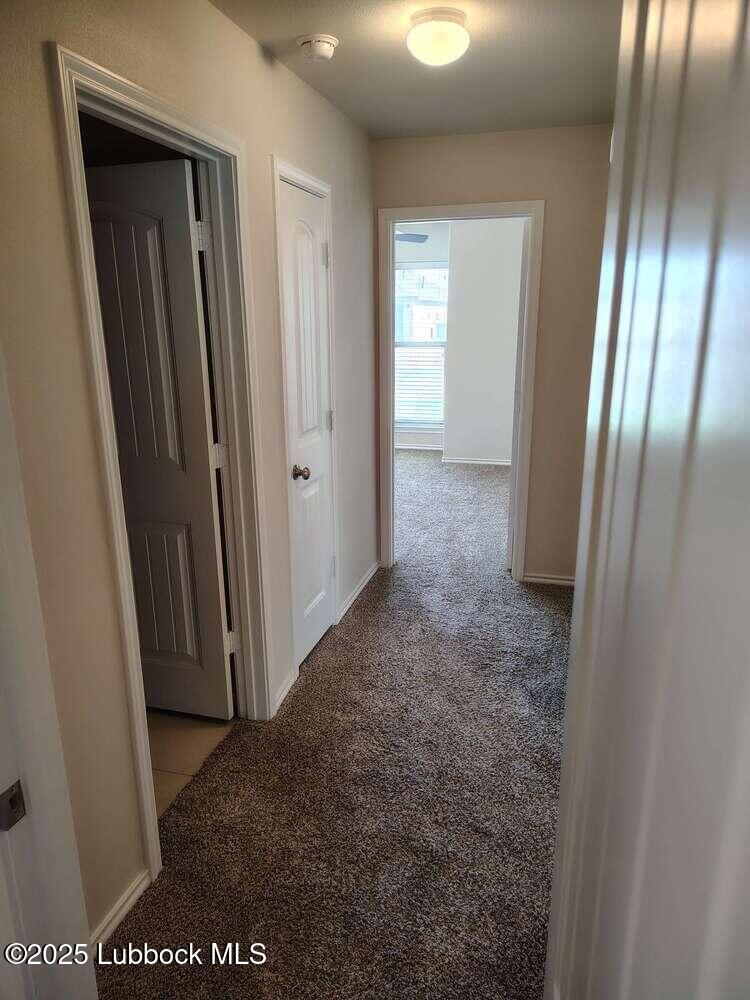 7046 95th Street Lubbock, TX 79424 - Photo 21 of 23 a view of hallway with windows