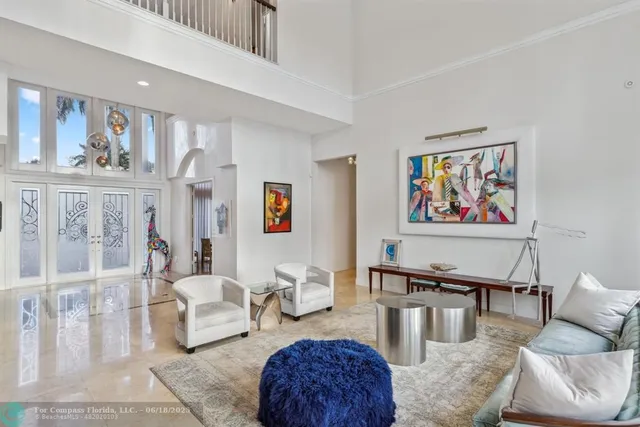 a dining hall with stainless steel appliances granite countertop a stove and a sink