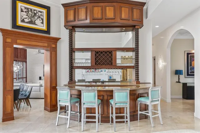 a bathroom with a tub a sink double vanity and a shower