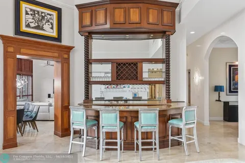 a large kitchen with stainless steel appliances granite countertop a stove a sink dishwasher and microwave