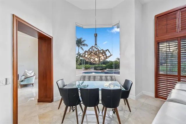 a bedroom with a bed next to a window with outer view