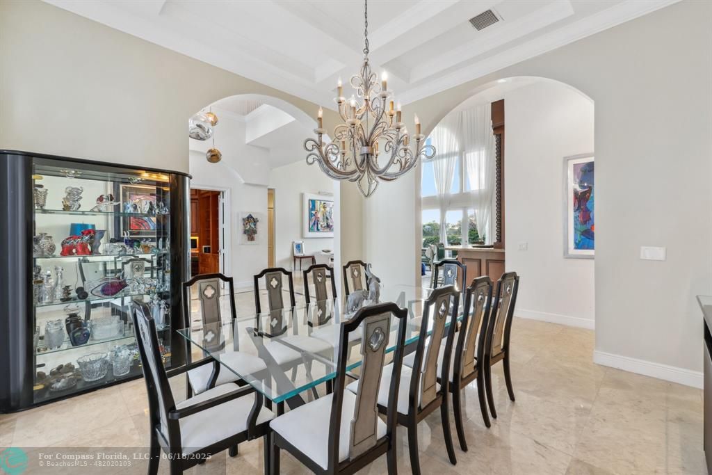 2753 West Stonebrook Circle Davie, FL 33330 - Photo 16 of 88 a view of a dining room with furniture and a chandelier