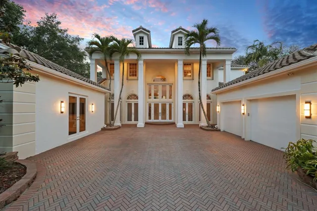 a view of a swimming pool with a yard