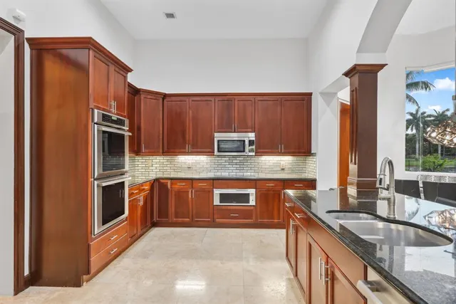 a bathroom with a sink toilet a mirror and shower