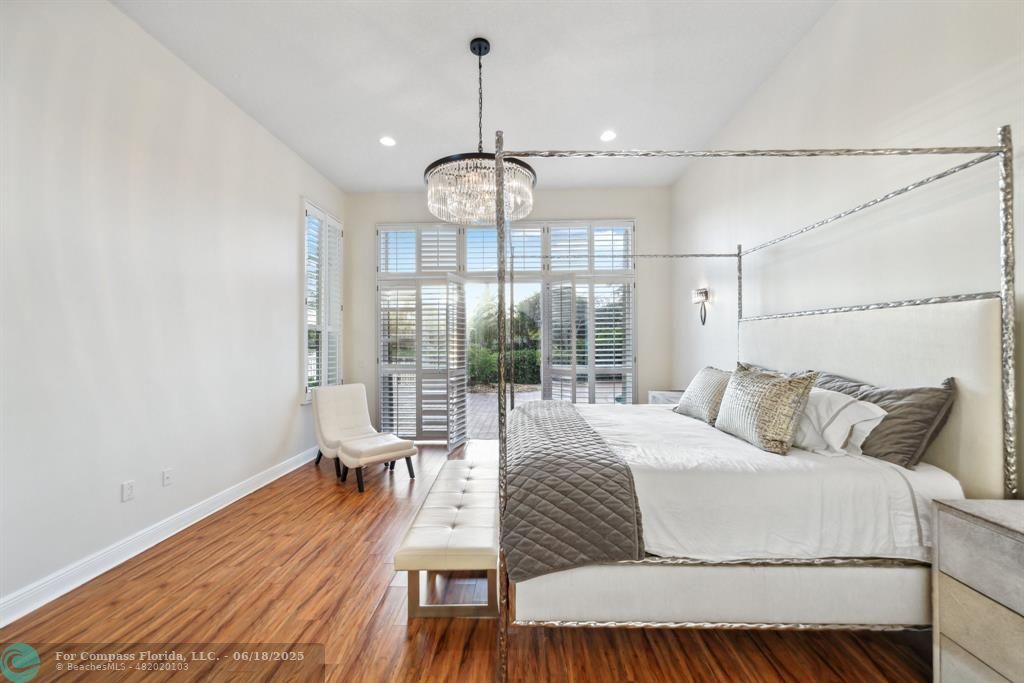 2753 West Stonebrook Circle Davie, FL 33330 - Photo 28 of 88 a living room with a bed and wooden floor