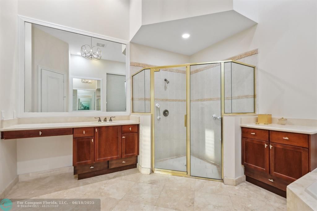 2753 West Stonebrook Circle Davie, FL 33330 - Photo 30 of 88 a spacious bathroom with a shower sink and mirror