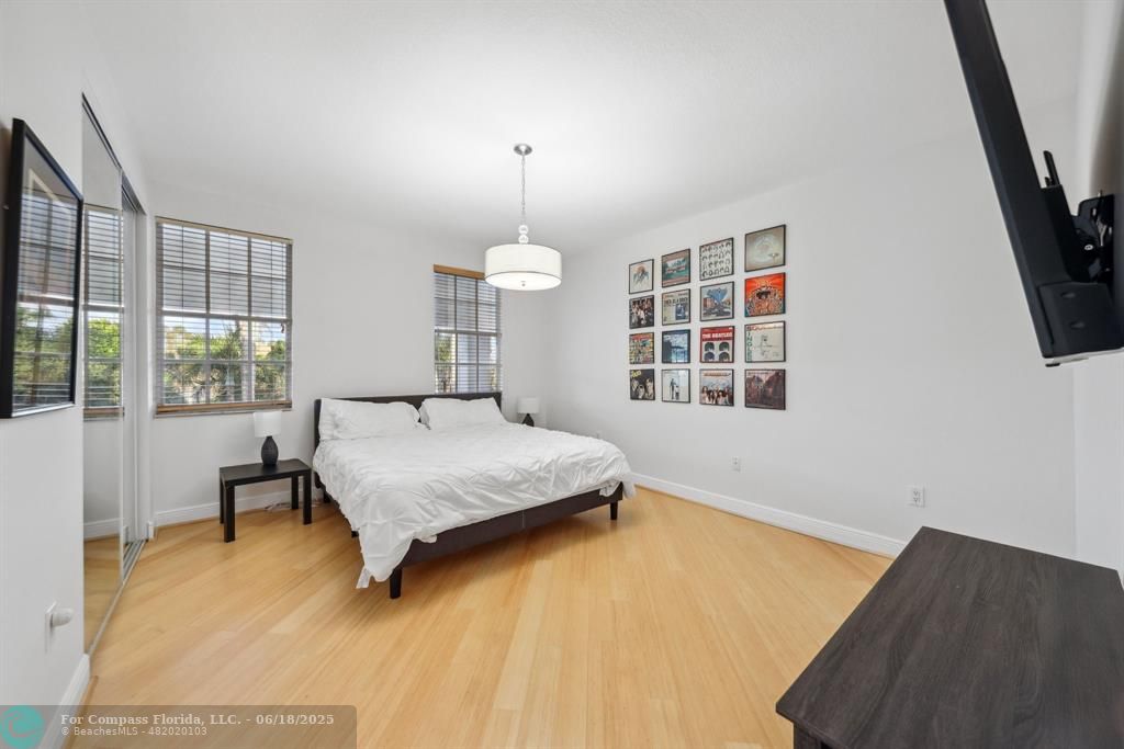 2753 West Stonebrook Circle Davie, FL 33330 - Photo 38 of 88 a bedroom with a bed next to a window with outer view