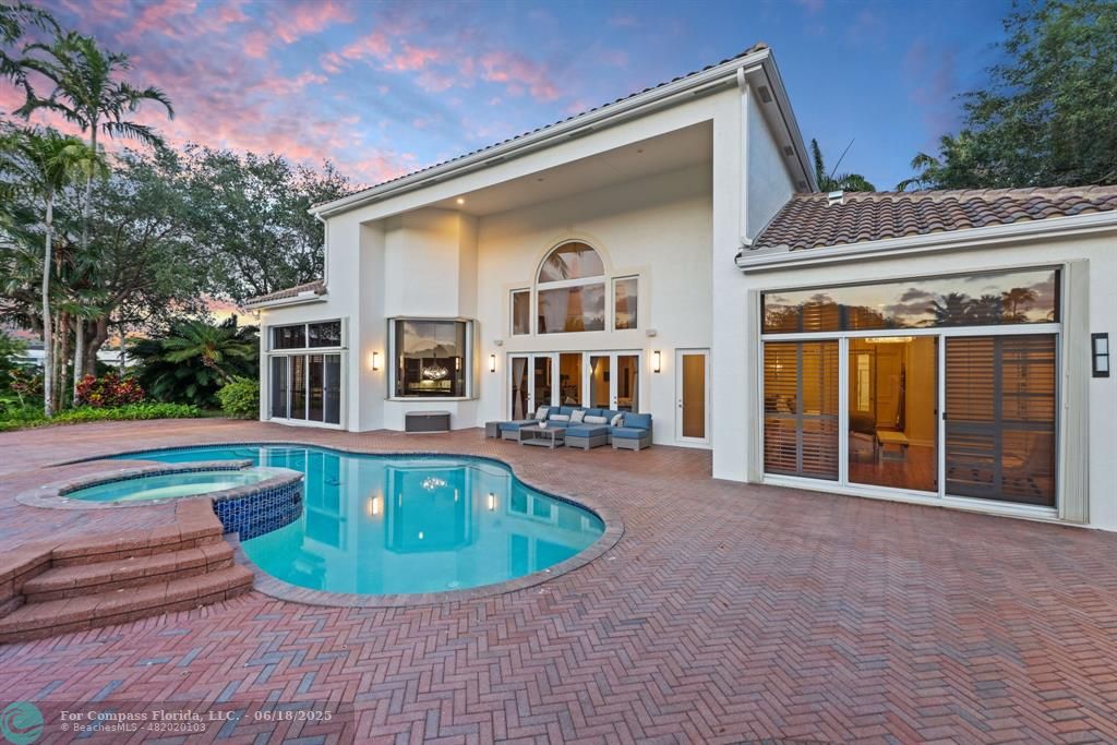 2753 West Stonebrook Circle Davie, FL 33330 - Photo 4 of 88 a view of a house with a swimming pool and sitting area