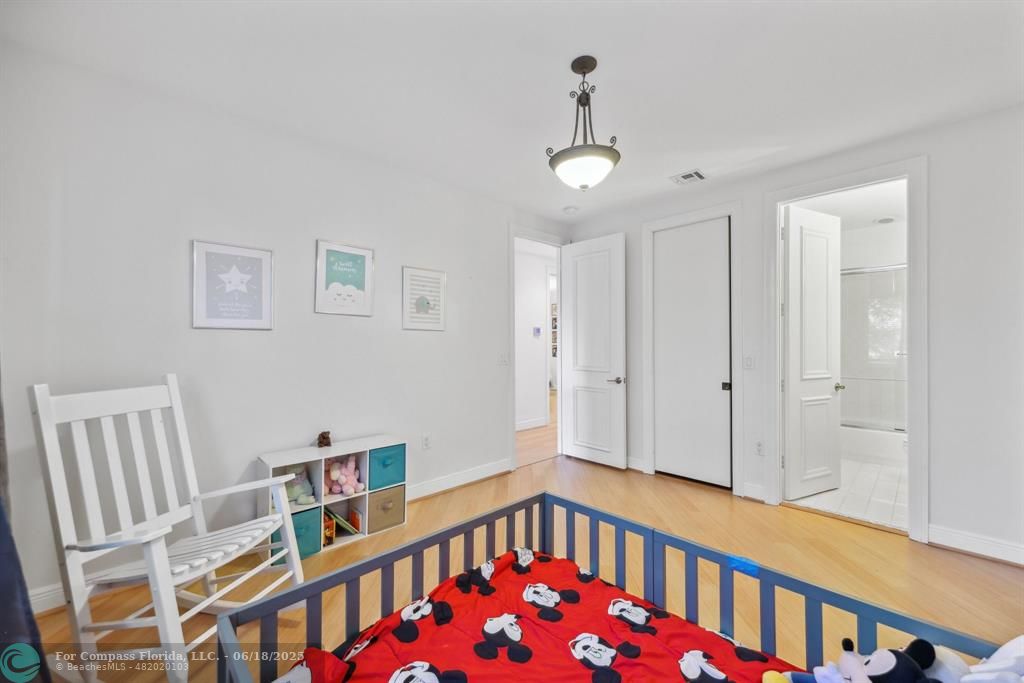 2753 West Stonebrook Circle Davie, FL 33330 - Photo 41 of 88 a bedroom with furniture and a book shelf