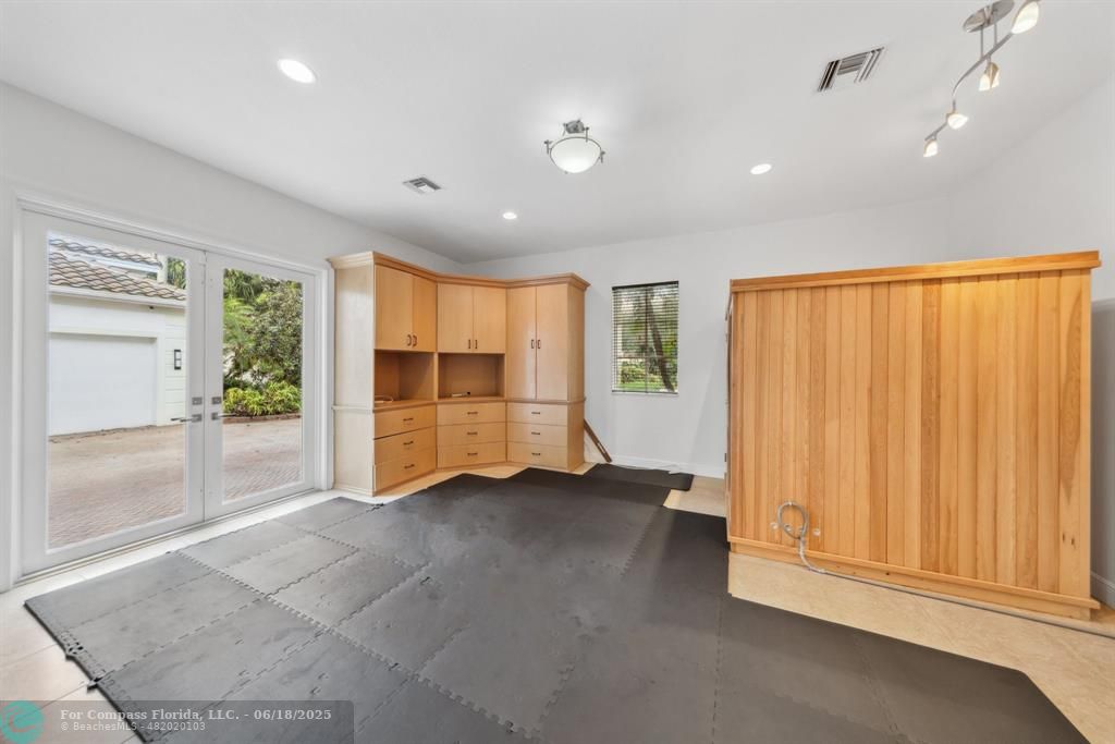 2753 West Stonebrook Circle Davie, FL 33330 - Photo 52 of 88 an empty room with wooden floor and windows