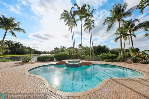 a living room with furniture a rug and a table