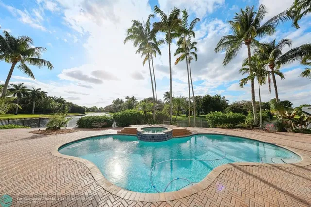 a living room with furniture a rug and a table