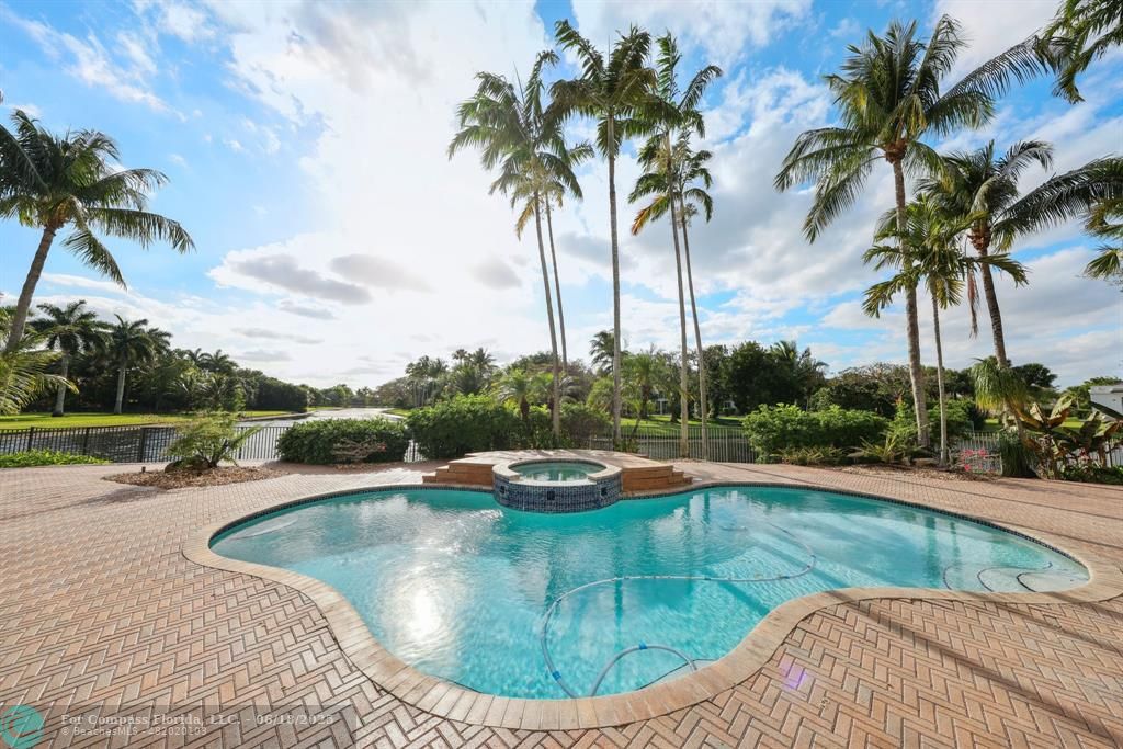 2753 West Stonebrook Circle Davie, FL 33330 - Photo 6 of 88 a view of a swimming pool with a yard