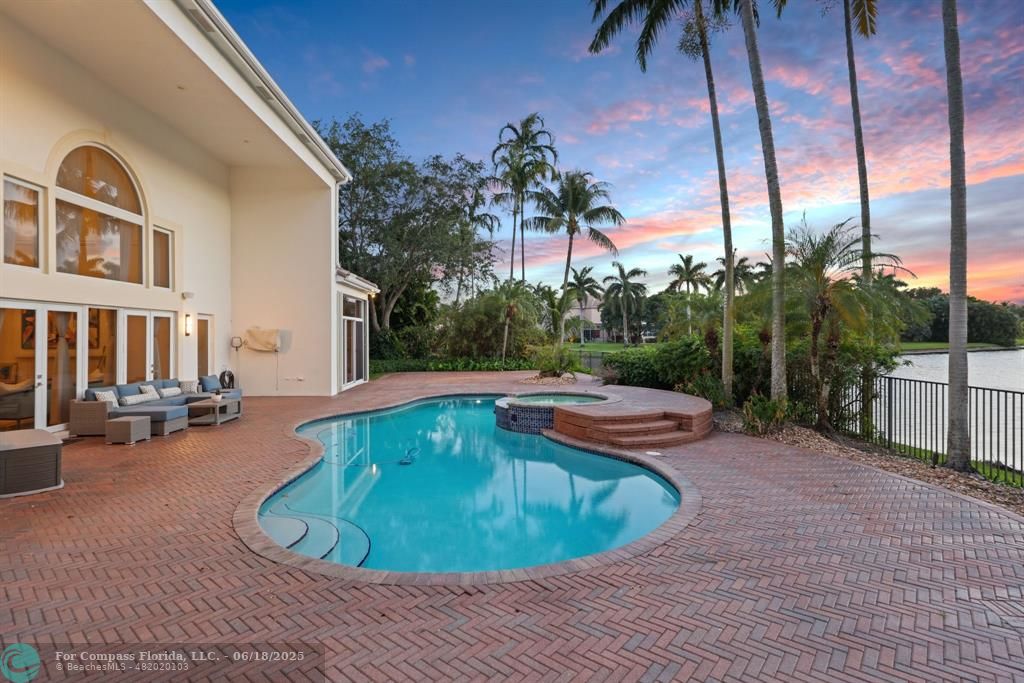 2753 West Stonebrook Circle Davie, FL 33330 - Photo 88 of 88 a view of a swimming pool with a lounge chairs