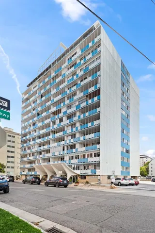 a front view of a building with street view