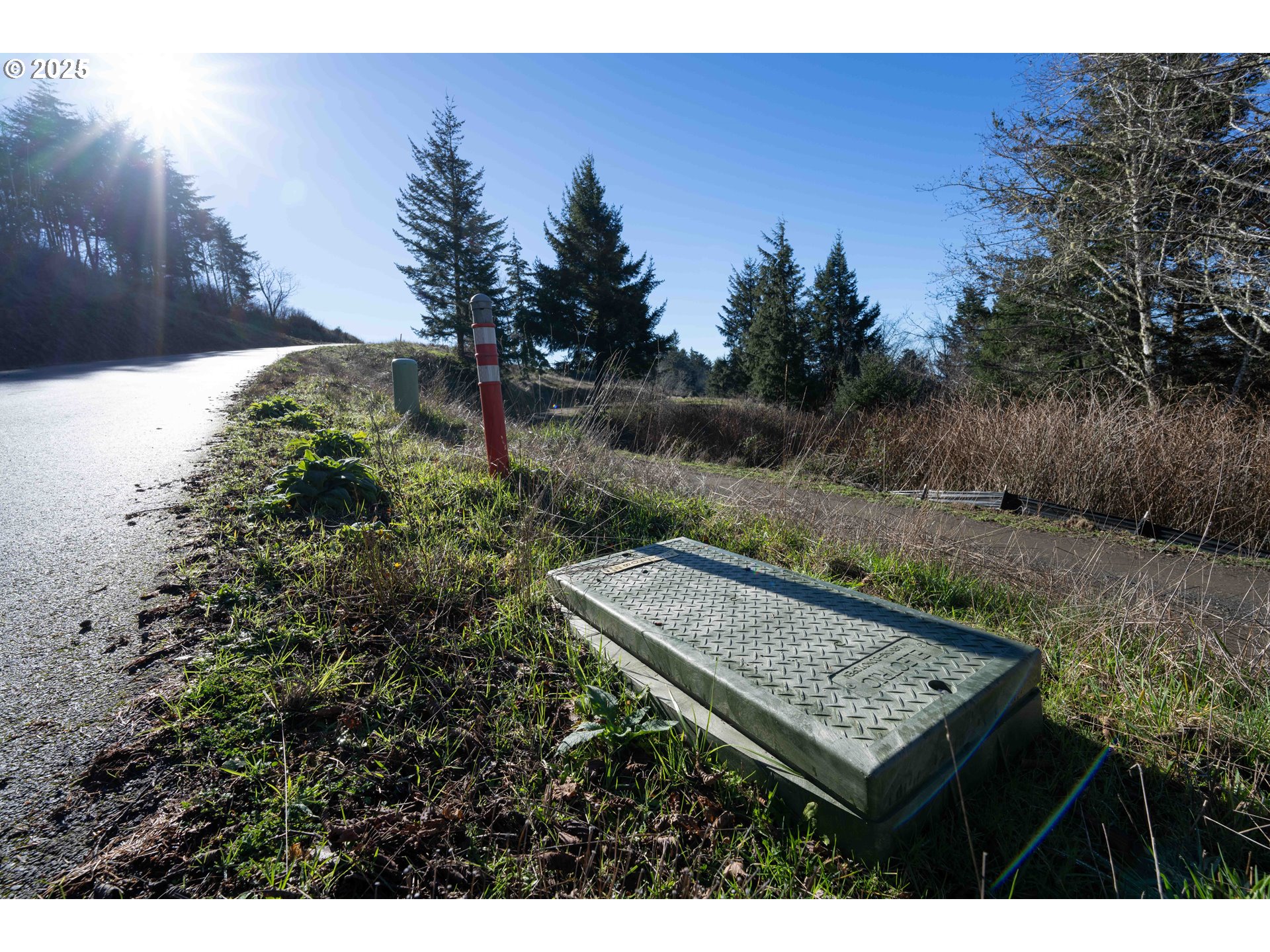Fiddle Back Road, Unit 3705 North Bend, OR 97459 - Photo 18 of 23 a view of a bench in front of lake