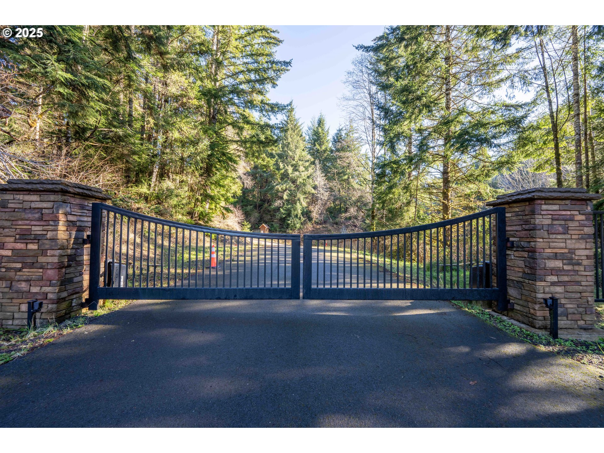 Fiddle Back Road, Unit 3705 North Bend, OR 97459 - Photo 2 of 23 a view of a gate with a wooden fence