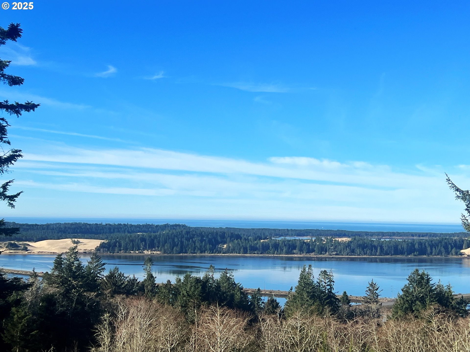 Fiddle Back Road, Unit 3705 North Bend, OR 97459 - Photo 3 of 23 a view of a lake with outside area