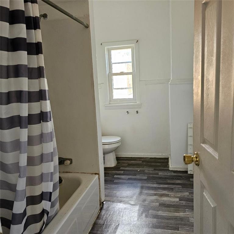 1424 4th Avenue Beaver Falls, PA 15010 - Photo 12 of 14 a bathroom with a bathtub and toilet