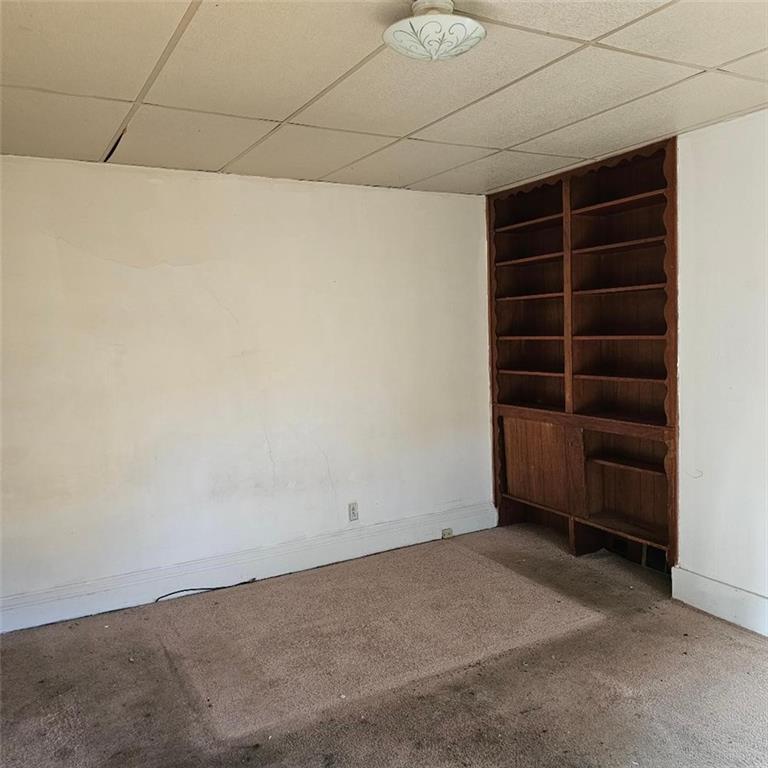 1424 4th Avenue Beaver Falls, PA 15010 - Photo 14 of 14 an empty room with a empty space and empty racks