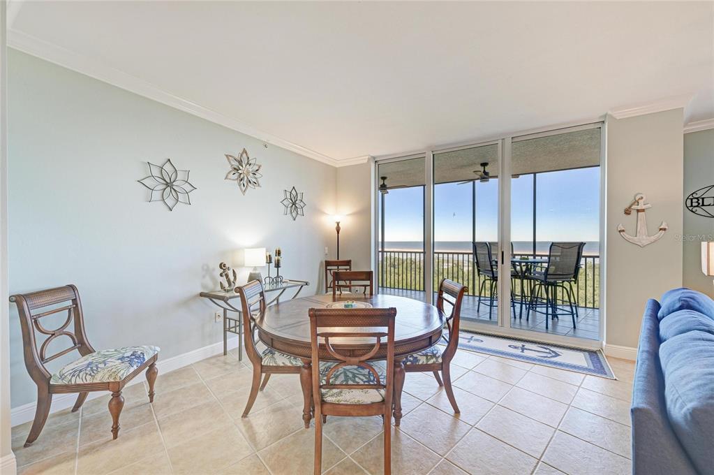 3329 Sunset Key Circle, Unit 407 Punta Gorda, FL 33955 - Photo 12 of 68 a view of a dining room with furniture and window