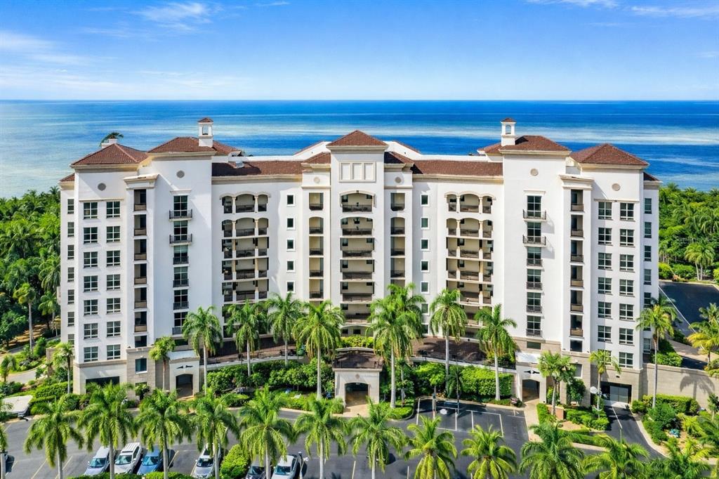 3329 Sunset Key Circle, Unit 407 Punta Gorda, FL 33955 - Photo 2 of 68 a front view of a building with a garden