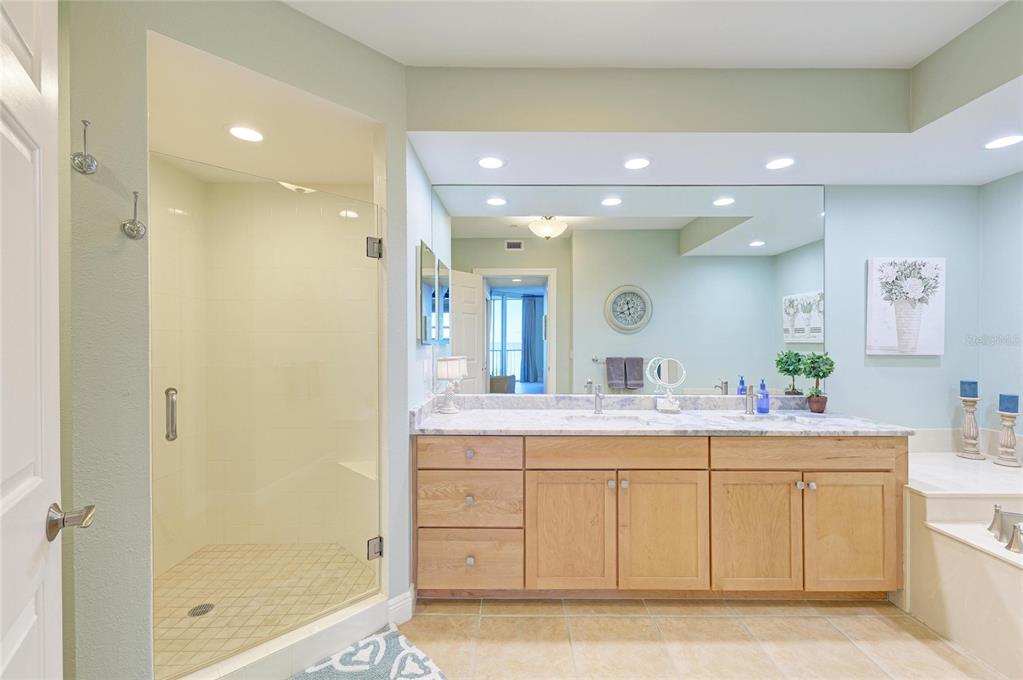 3329 Sunset Key Circle, Unit 407 Punta Gorda, FL 33955 - Photo 27 of 68 a bathroom with a sink mirror and a shower