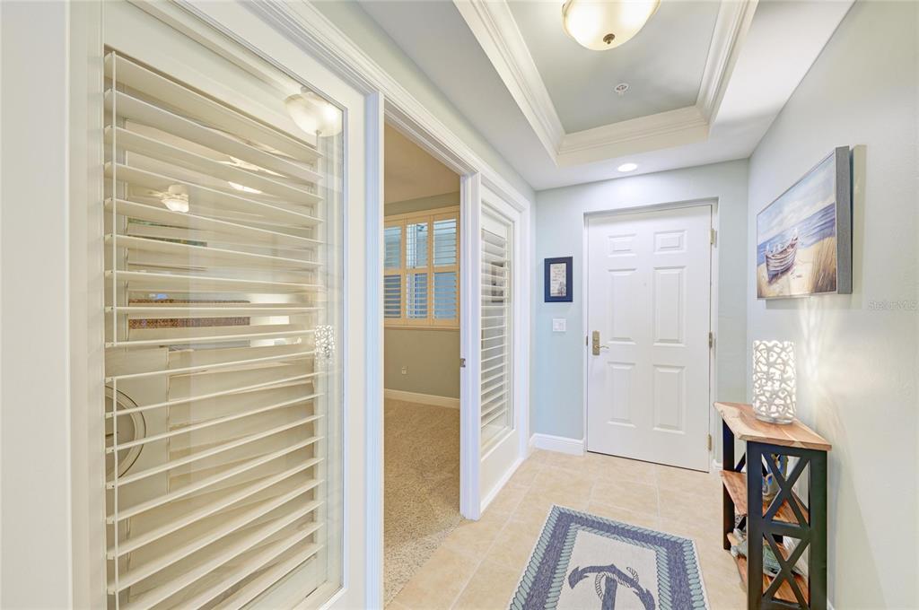 3329 Sunset Key Circle, Unit 407 Punta Gorda, FL 33955 - Photo 35 of 68 a view of a hallway with wooden floor and dining room