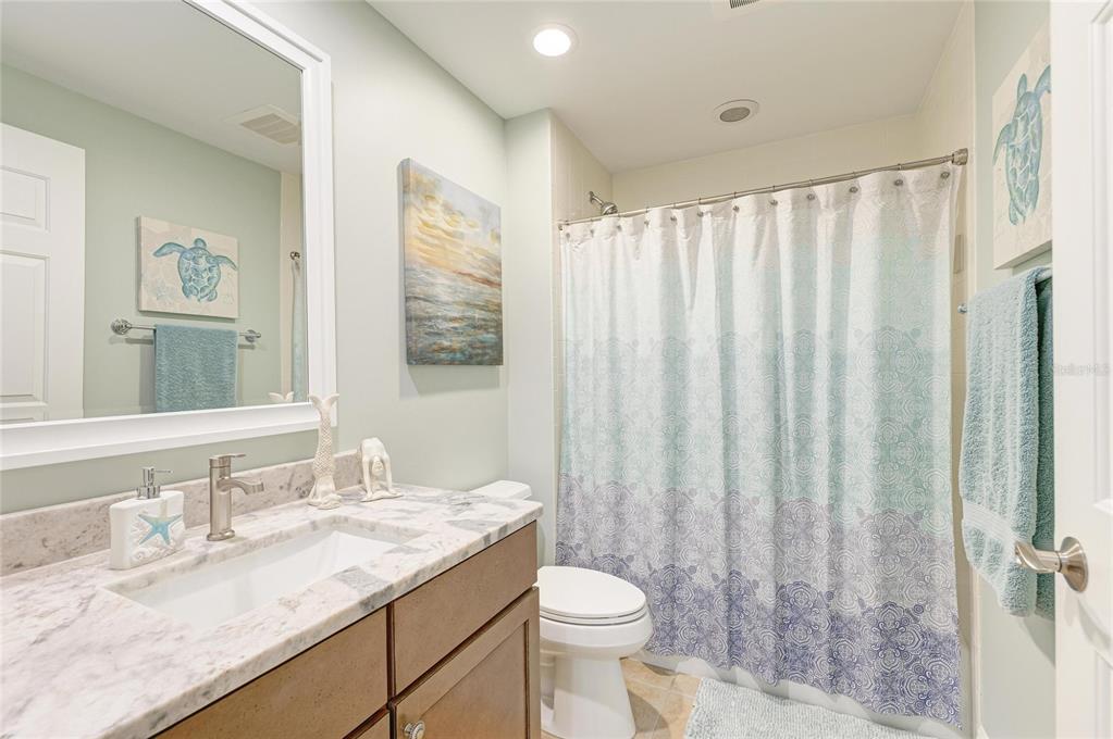 3329 Sunset Key Circle, Unit 407 Punta Gorda, FL 33955 - Photo 41 of 68 a bathroom with a granite countertop sink toilet and shower