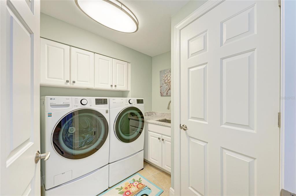 3329 Sunset Key Circle, Unit 407 Punta Gorda, FL 33955 - Photo 42 of 68 a utility room with dryer and washer