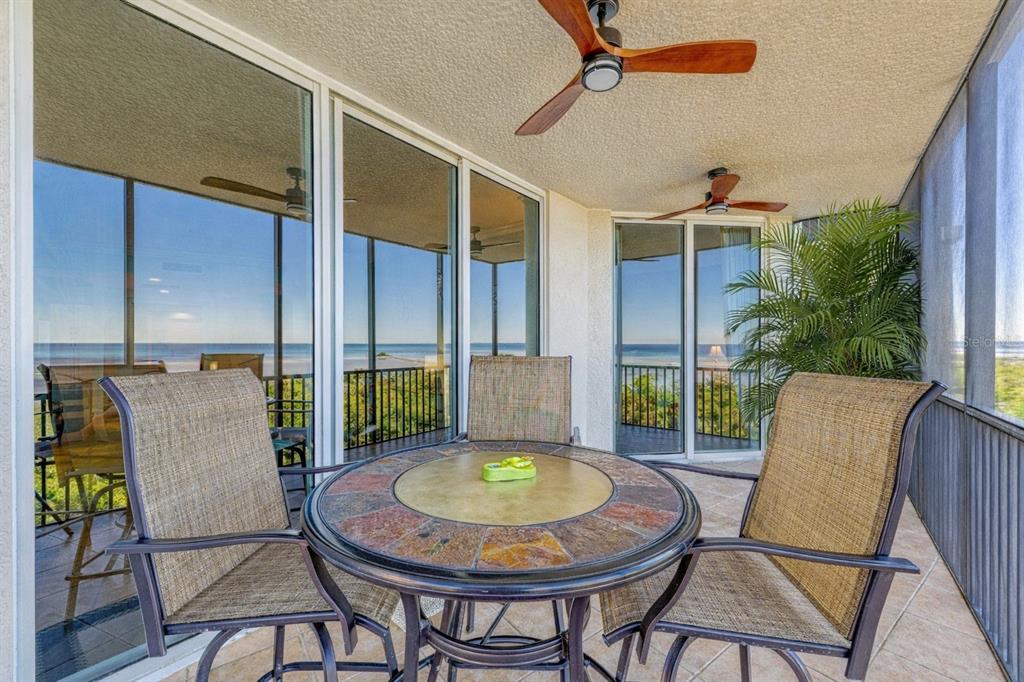 3329 Sunset Key Circle, Unit 407 Punta Gorda, FL 33955 - Photo 44 of 68 a view of a chairs and table in the patio
