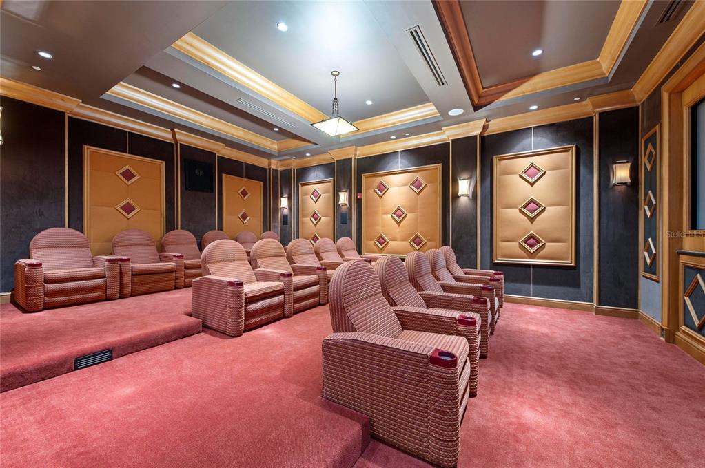 3329 Sunset Key Circle, Unit 407 Punta Gorda, FL 33955 - Photo 59 of 68 a living room with furniture a rug and a chandelier