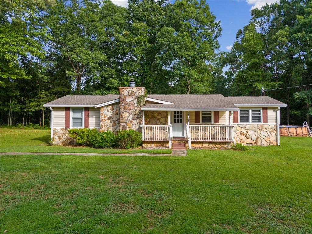 2051 Darby Road Waleska, GA 30183 - Photo 1 of 1 a front view of a house with a garden