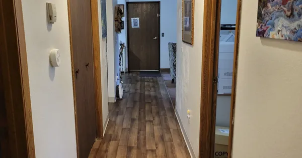 a bathroom with a sink a toilet and shower curtain