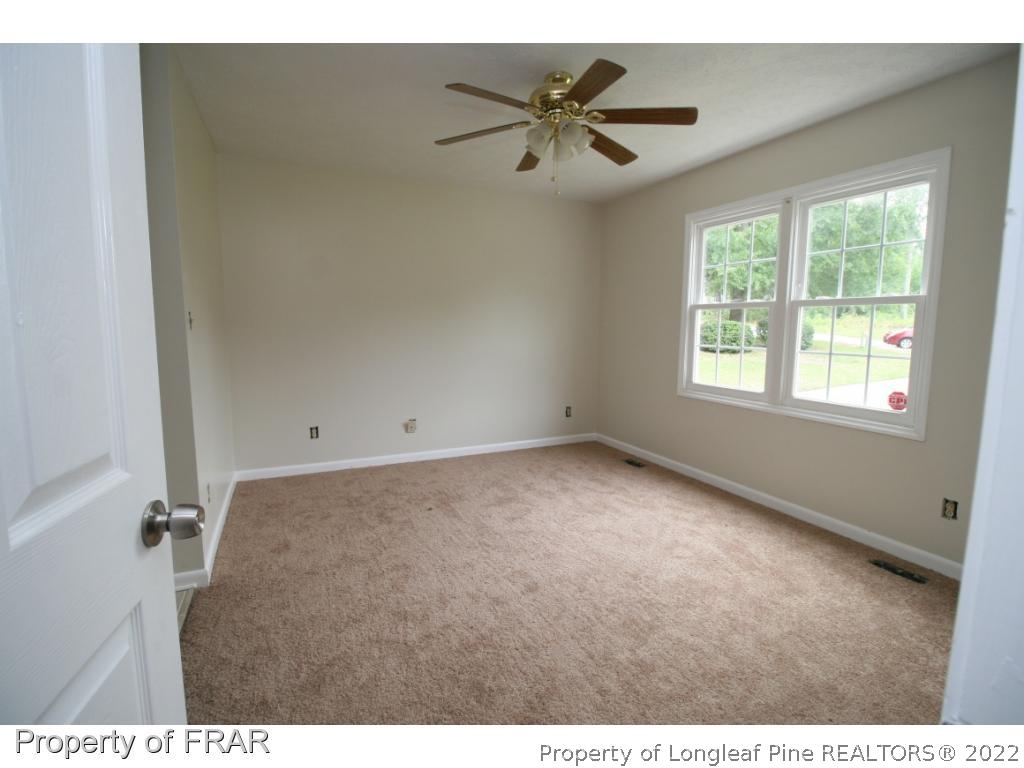 2255 Hackney Loop Fayetteville, NC 28304 - Photo 11 of 36 a view of an empty room with a window