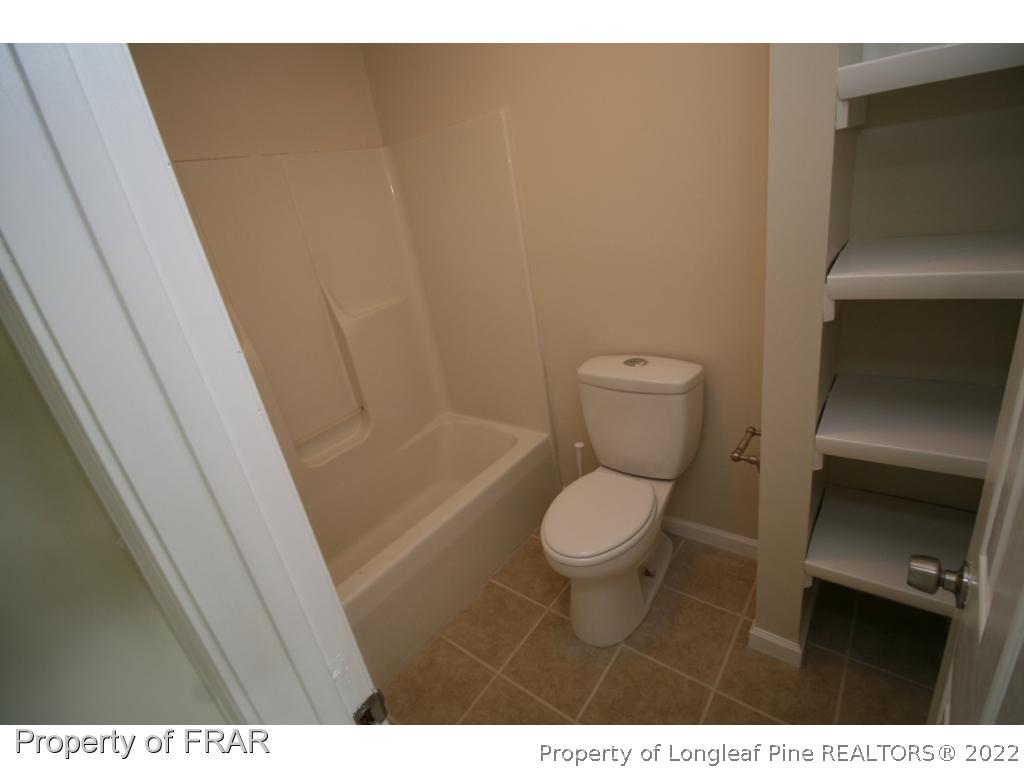 2255 Hackney Loop Fayetteville, NC 28304 - Photo 12 of 36 a bathroom with a toilet and a sink