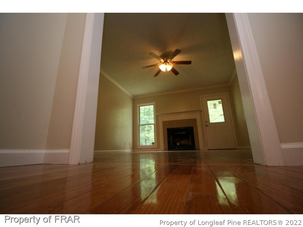 2255 Hackney Loop Fayetteville, NC 28304 - Photo 16 of 36 a view of livingroom and kitchen with fireplace