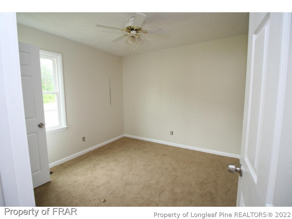 2255 Hackney Loop Fayetteville, NC 28304 - Photo 18 of 36 a view of an empty room with a window
