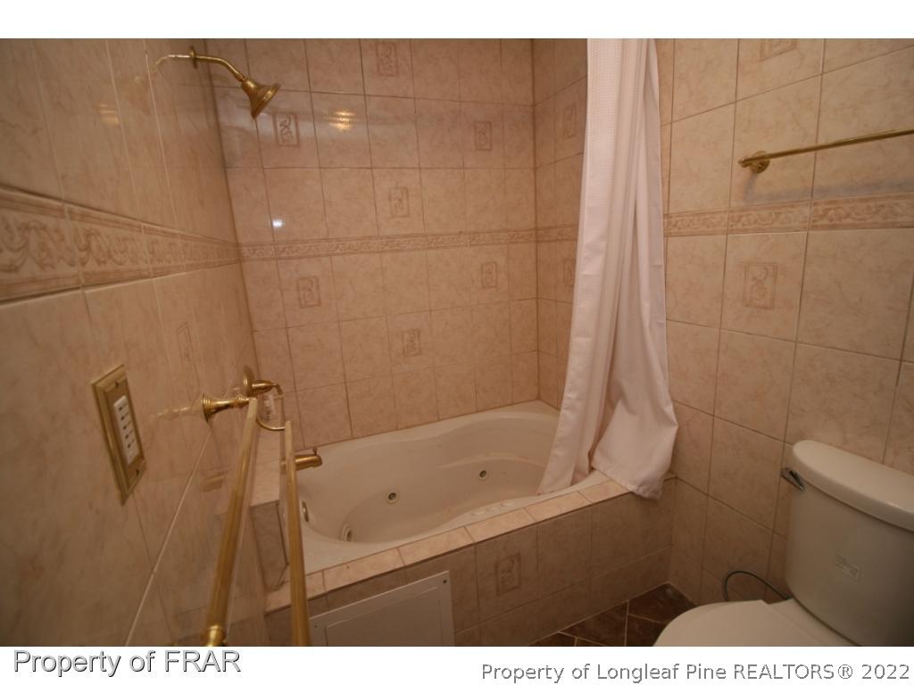 2255 Hackney Loop Fayetteville, NC 28304 - Photo 20 of 36 a bathroom with a shower