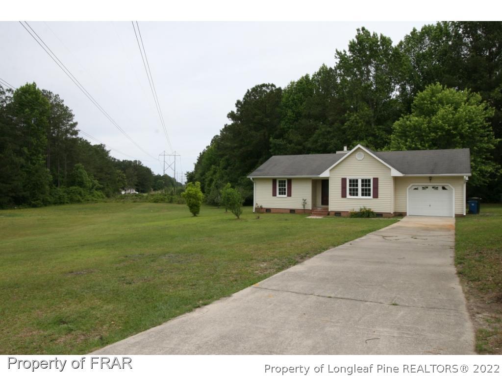 2255 Hackney Loop Fayetteville, NC 28304 - Photo 36 of 36 a view of house with garden