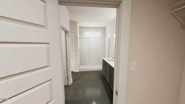 a bathroom with a double vanity sink and mirror