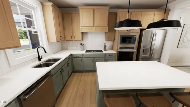 a kitchen with stainless steel appliances a stove a sink a microwave a refrigerator a sink and dishwasher