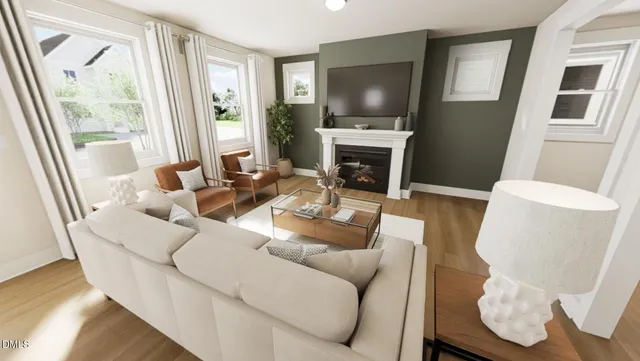 a living room with fireplace furniture and a flat screen tv