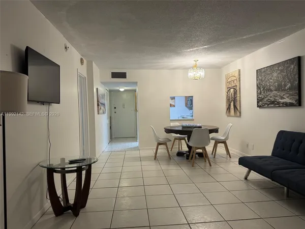 a view of a dining room with furniture
