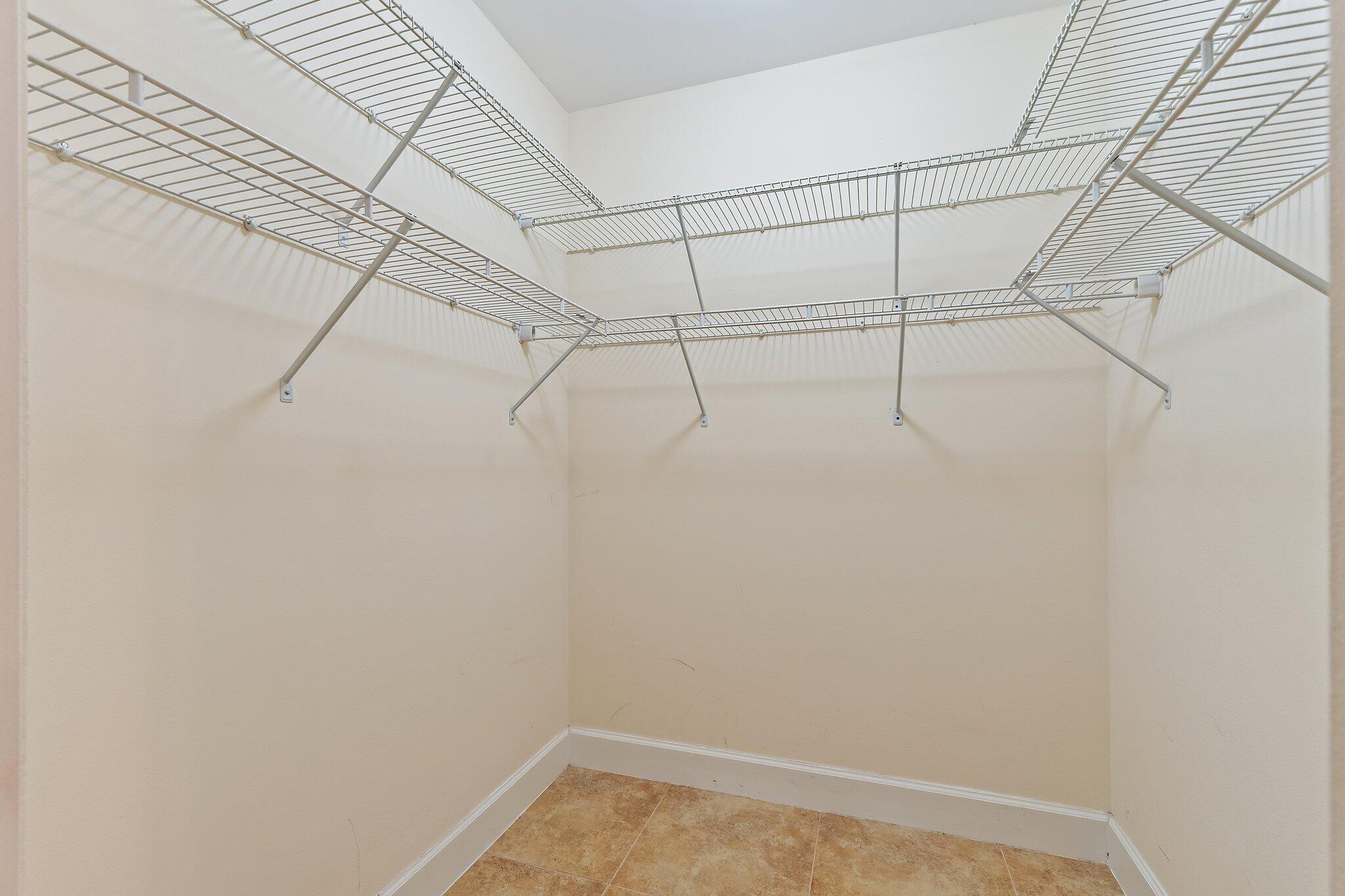 109 Doe Trail Jupiter, FL 33458 - Photo 16 of 26 a view of a room with racks on the wall